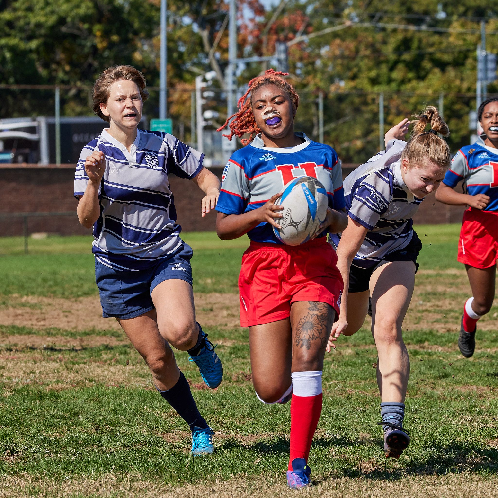 Howard University's Te'Vonya Jeter brings the ball in for a touchdown during a heated Rugby match.